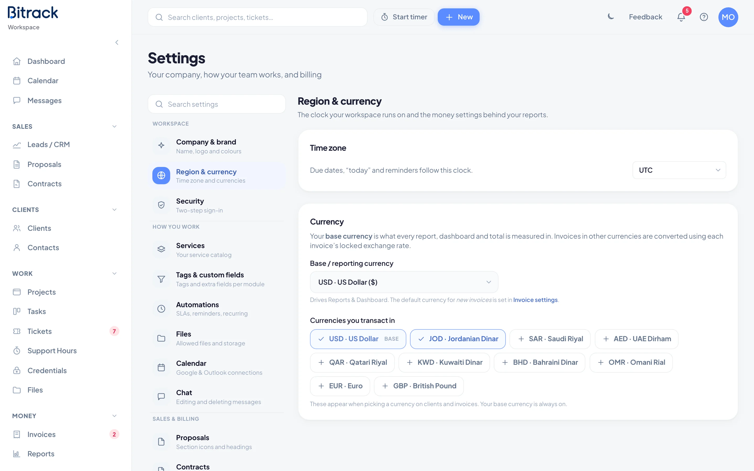 The Region & currency section with time zone and currency settings
